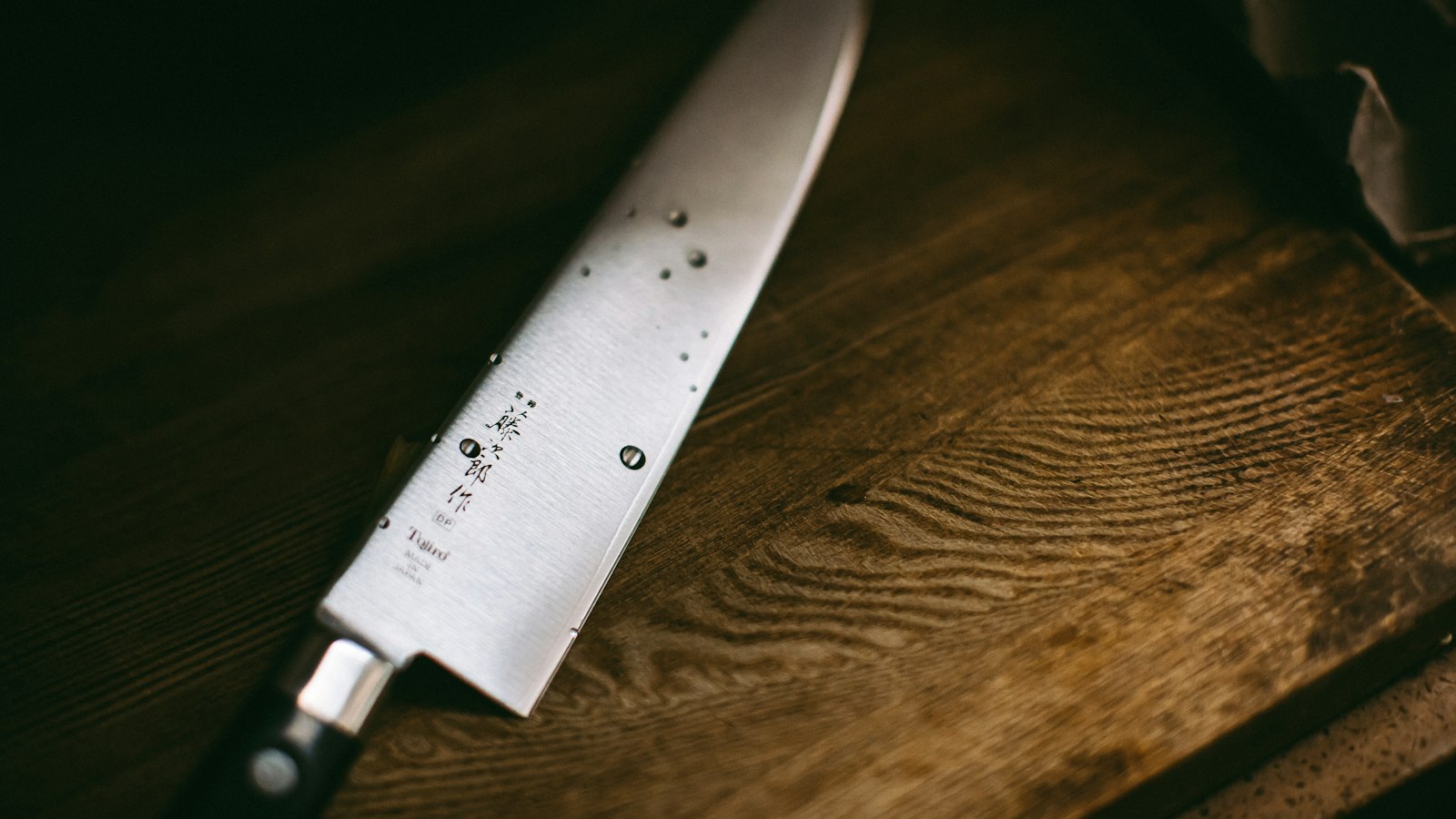 Japanese chef knife on a wooden surface